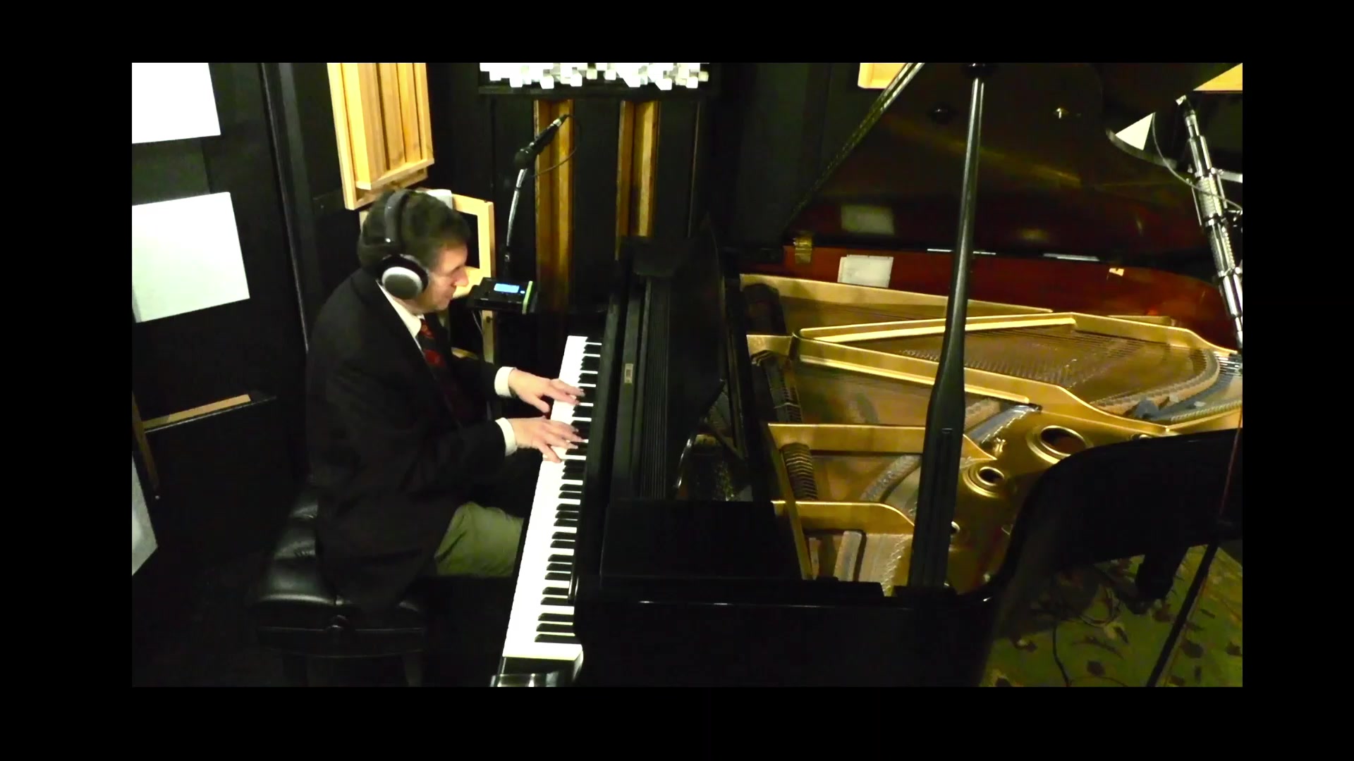Phillip L. Pearl playing a grand piano