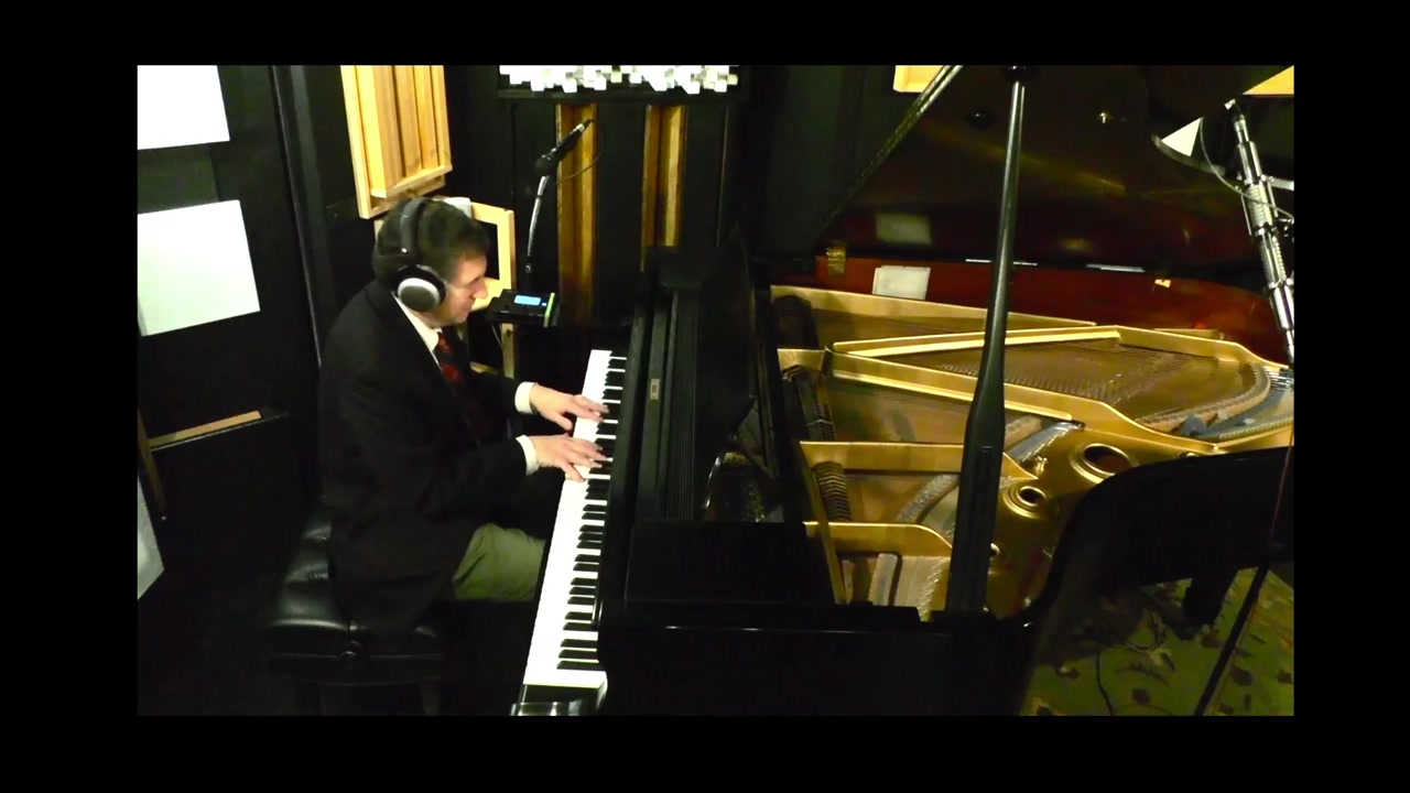 Phillip L. Pearl performing Our Love Is Here to Stay at the piano