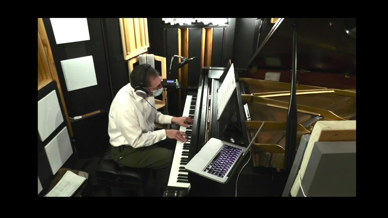 Phillip L. Pearl performing What Is This Thing Called Love? at the piano